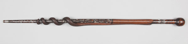 Photograph of walking stick, with carved snake design